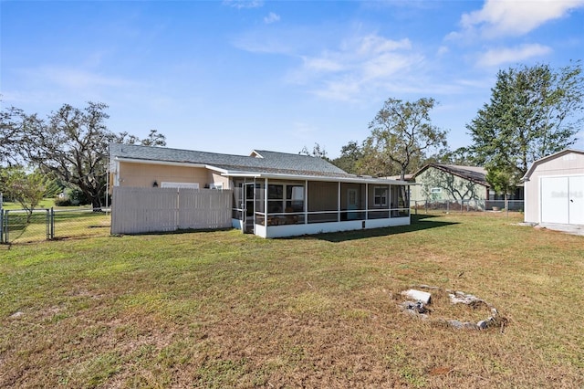 back of property featuring a lawn