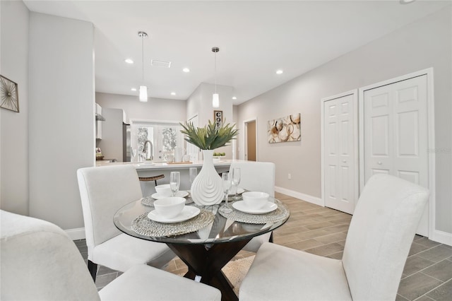 dining space featuring hardwood / wood-style flooring