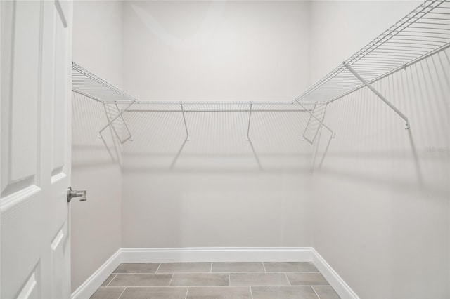 walk in closet featuring tile patterned floors