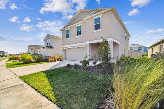 view of front of house with a garage and a front lawn