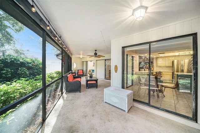 sunroom / solarium with ceiling fan