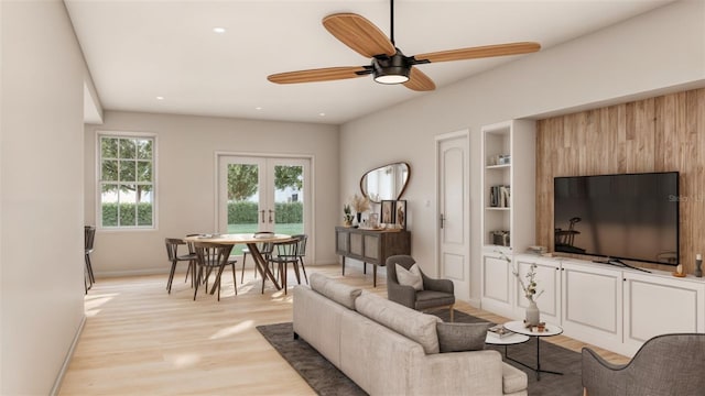 living room featuring ceiling fan, french doors, and light hardwood / wood-style flooring