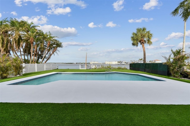 view of swimming pool with a water view