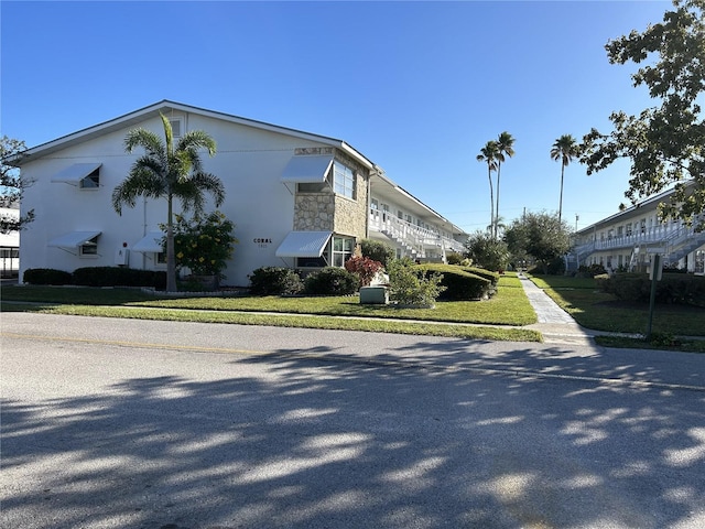 view of side of home featuring a yard