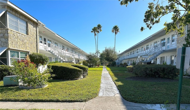 view of home's community with a yard