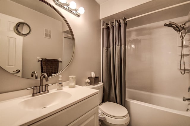 full bathroom featuring shower / bath combo, vanity, and toilet