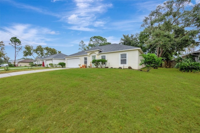 ranch-style house with a garage and a front lawn