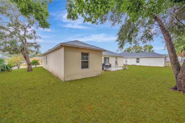 rear view of house with a yard