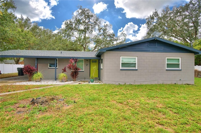 ranch-style house featuring a front lawn