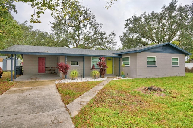 single story home featuring a front lawn and a carport