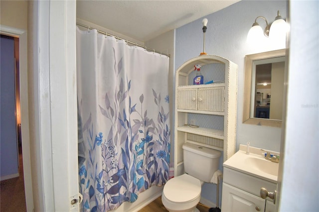 full bathroom featuring vanity, toilet, and shower / tub combo with curtain