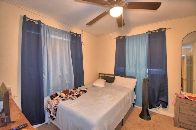 bedroom featuring ceiling fan and light colored carpet