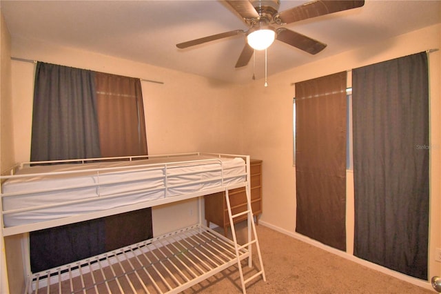 unfurnished bedroom featuring carpet and ceiling fan