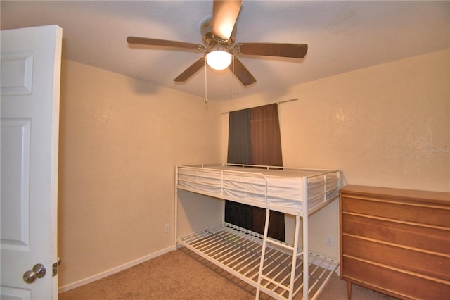 unfurnished bedroom with ceiling fan and carpet floors