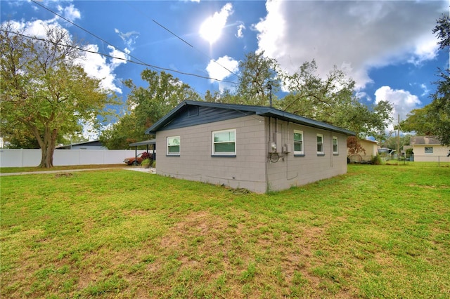 view of property exterior featuring a lawn