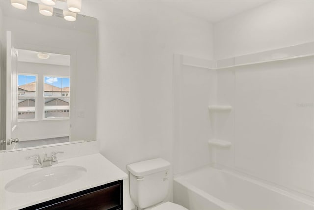 full bathroom with vanity, shower / bathtub combination, and toilet