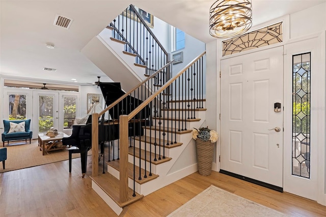 foyer featuring hardwood / wood-style flooring and an inviting chandelier