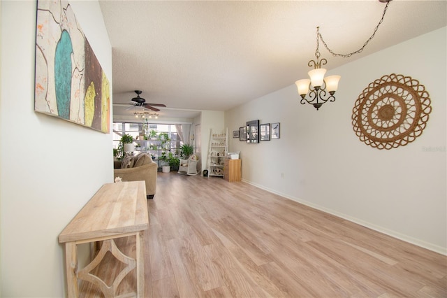 interior space featuring a chandelier, a textured ceiling, and hardwood / wood-style flooring