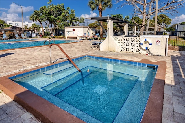 5501 80th St N Unit 214, Saint Petersburg, FL 33709 - community pool featuring a community hot tub, a gazebo, and a patio area