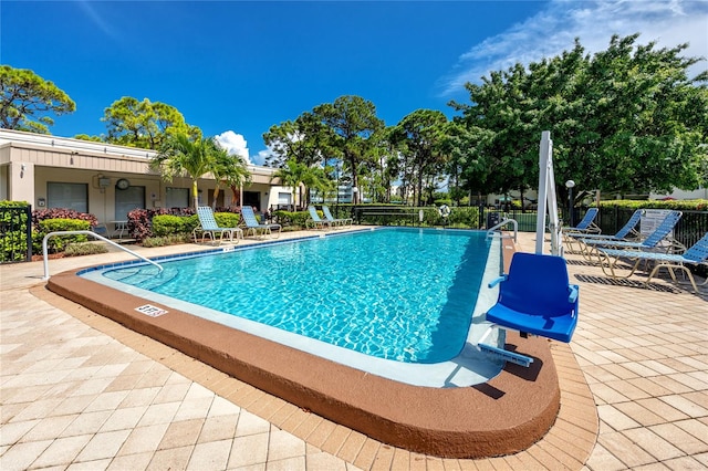 view of swimming pool with a patio