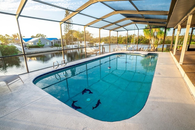 view of pool featuring a lanai, a patio area, and a water view