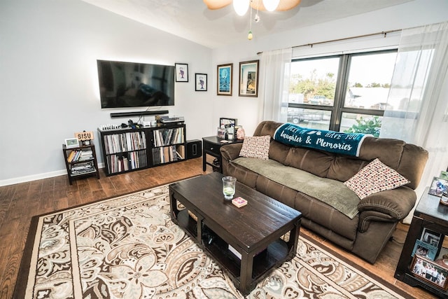 living room featuring hardwood / wood-style floors, ceiling fan, and lofted ceiling