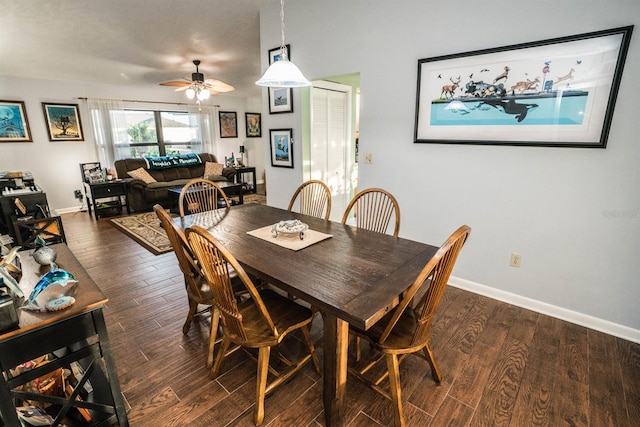 dining space featuring ceiling fan and dark wood-type flooring