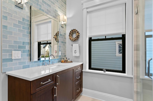 bathroom featuring tasteful backsplash and vanity