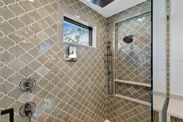 bathroom with tiled shower