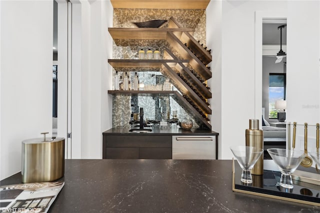 bar with tasteful backsplash and sink