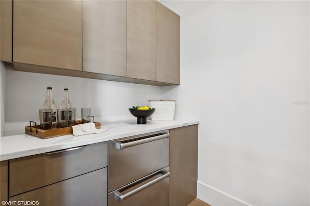 kitchen with light stone countertops