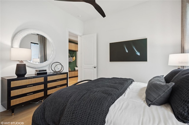 bedroom with ceiling fan and light hardwood / wood-style floors