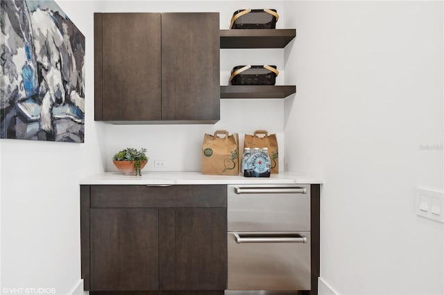 bar featuring dark brown cabinets