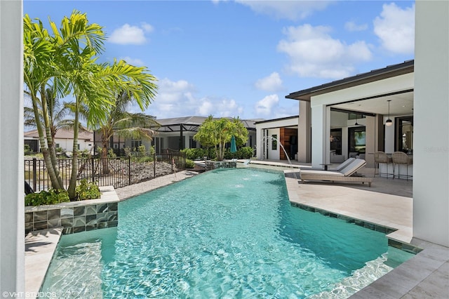 view of swimming pool featuring pool water feature and a patio