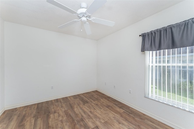 spare room featuring hardwood / wood-style flooring and ceiling fan