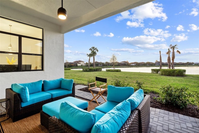 view of patio / terrace with an outdoor hangout area and a water view