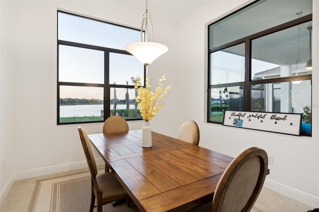 dining room with a water view