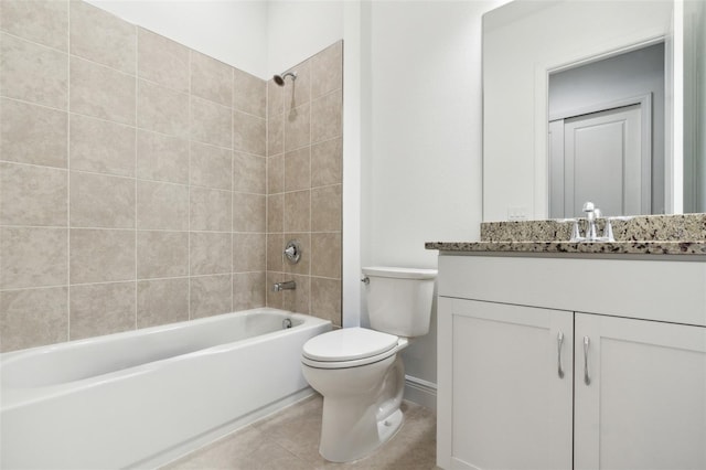 full bathroom featuring tile patterned floors, vanity, tiled shower / bath combo, and toilet