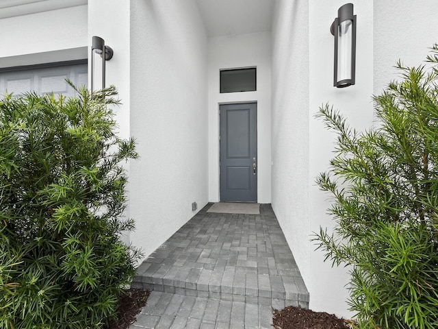 9132 Bernini Pl, Sarasota, FL 34240 - view of exterior entry featuring stucco siding