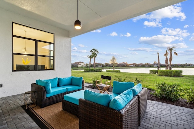 9132 Bernini Pl, Sarasota, FL 34240 - view of patio featuring an outdoor living space and a water view