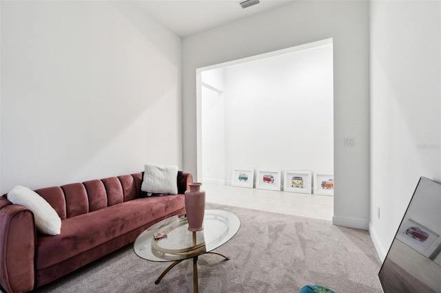 9132 Bernini Pl, Sarasota, FL 34240 - carpeted living area featuring baseboards