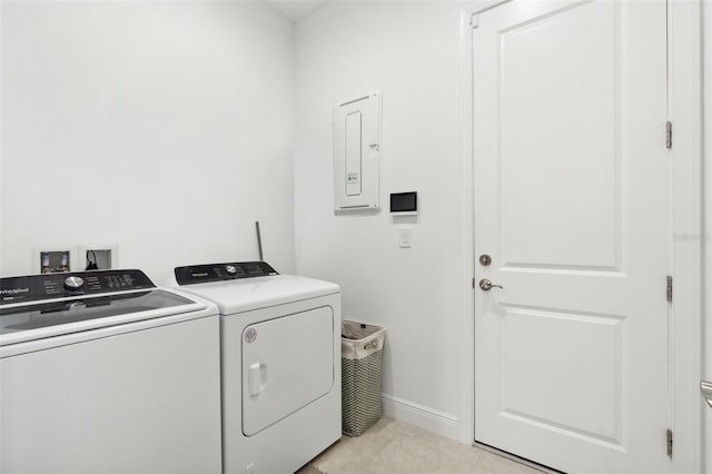 9132 Bernini Pl, Sarasota, FL 34240 - laundry room with washing machine and dryer, electric panel, baseboards, and light tile patterned floors