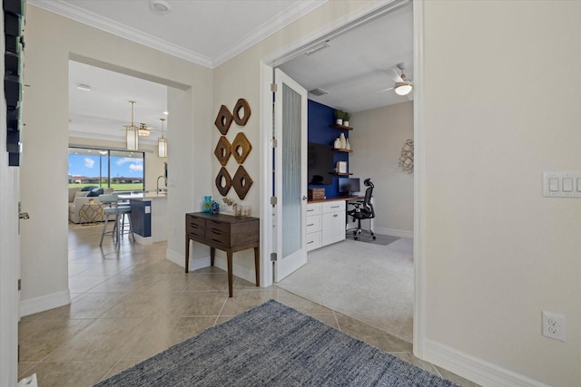 23503 Waverly Cir, Venice, FL 34293 - hall with a desk, tile patterned floors, baseboards, crown molding, and a chandelier