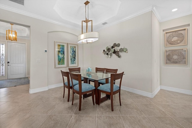 23503 Waverly Cir, Venice, FL 34293 - dining space with crown molding, light tile patterned flooring, baseboards, and a raised ceiling