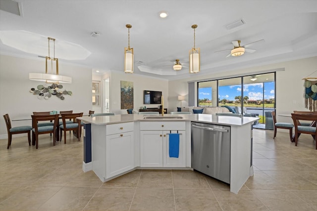 23503 Waverly Cir, Venice, FL 34293 - kitchen featuring dishwasher, a tray ceiling, crown molding, a sink, and open floor plan