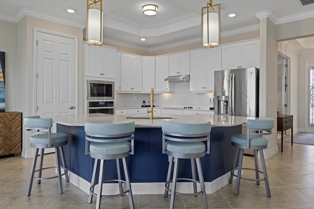 23503 Waverly Cir, Venice, FL 34293 - kitchen with appliances with stainless steel finishes, a sink, under cabinet range hood, white cabinets, and crown molding
