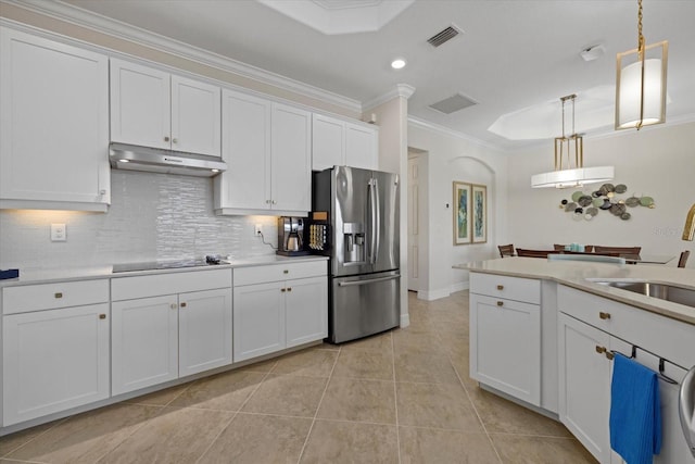 kitchen with pendant lighting, white cabinetry, stainless steel fridge with ice dispenser, and black electric cooktop