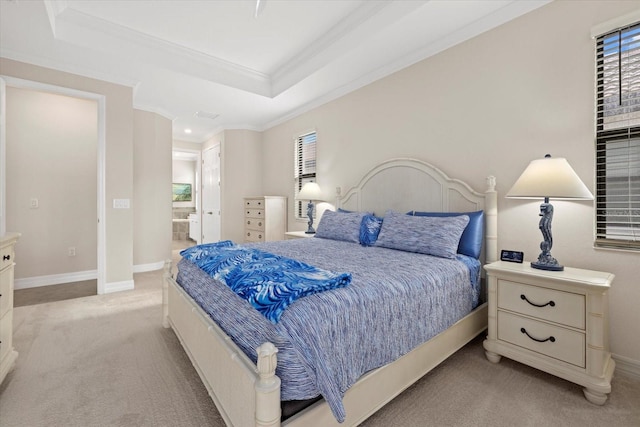 23503 Waverly Cir, Venice, FL 34293 - bedroom with light carpet, ornamental molding, a tray ceiling, ensuite bathroom, and baseboards