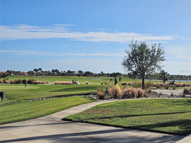 23503 Waverly Cir, Venice, FL 34293 - view of community with a lawn, a water view, and golf course view