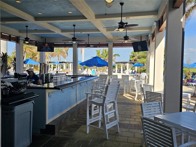 23503 Waverly Cir, Venice, FL 34293 - view of patio / terrace featuring an outdoor bar and ceiling fan